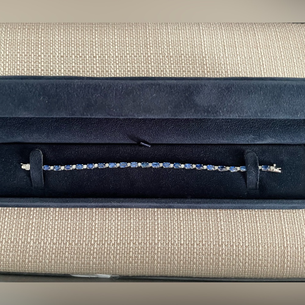 Women’s authentic 14KT white gold sapphire and diamond tennis bracelet.